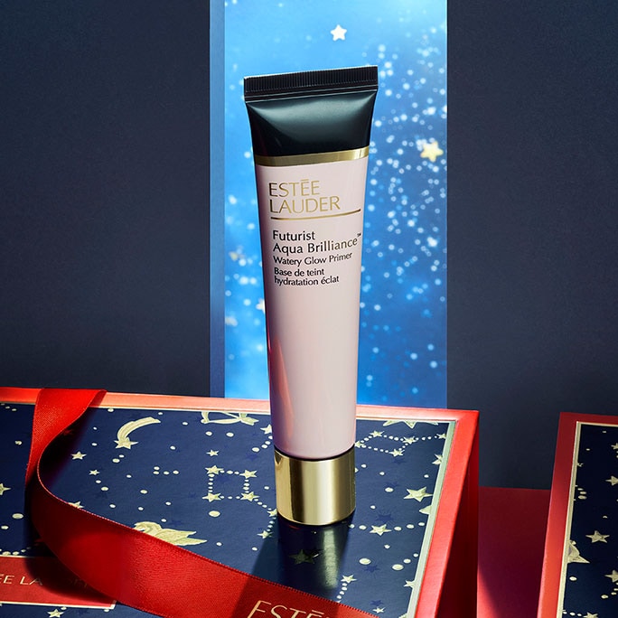Estée Lauder Futurist primer displayed in a red and navy-blue scene with a starry background
