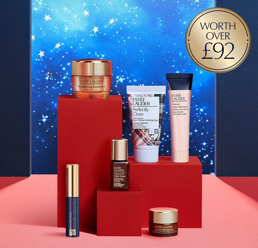 Estee Lauder products on a blue and red background