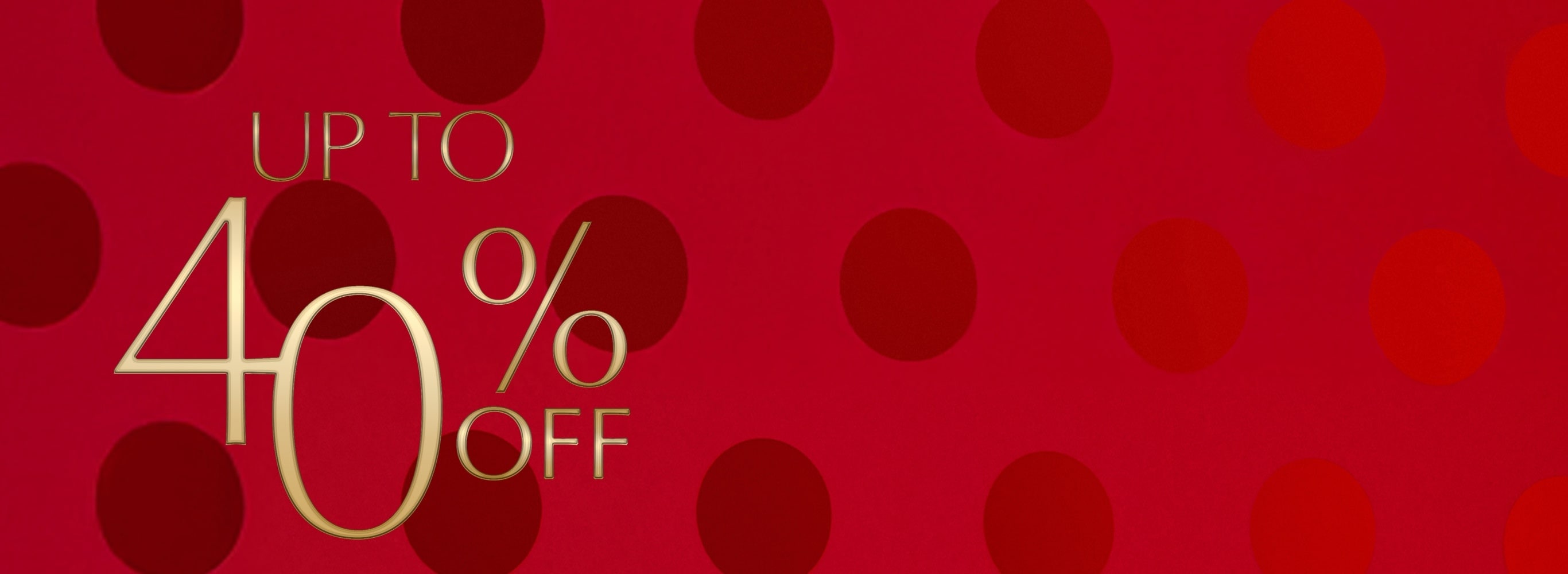Up to 40% off on a red polka dot background