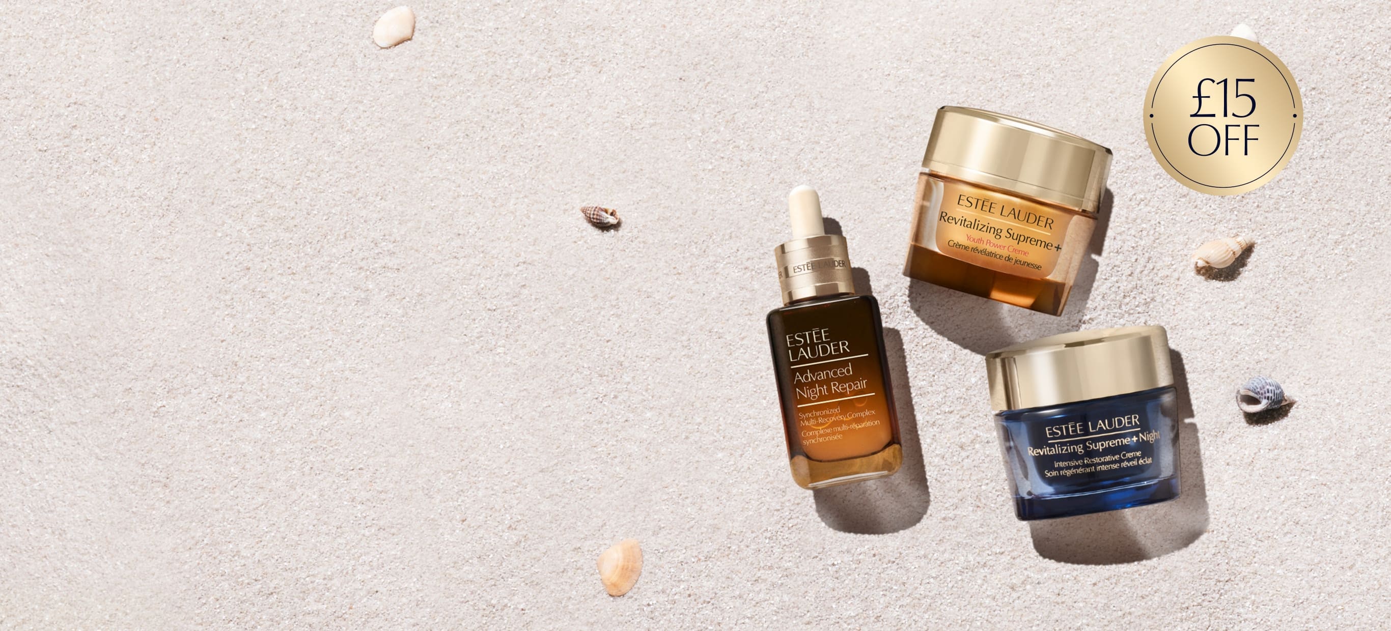 Estee Lauder complexion products on a neutral background