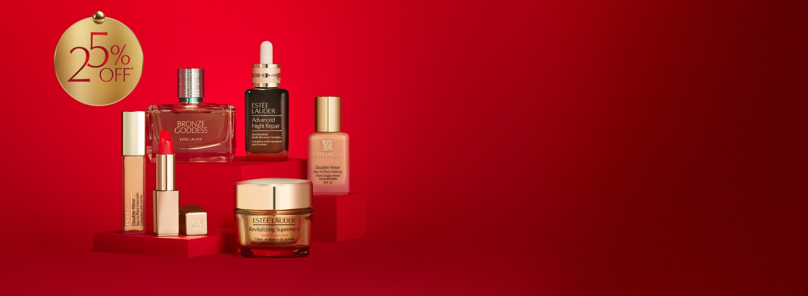 A selection of Estée Lauder products on a red background.