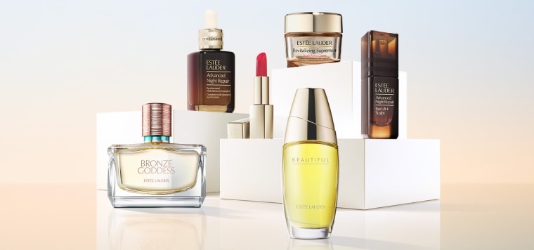 A selection of Estee Lauder products on a blue background