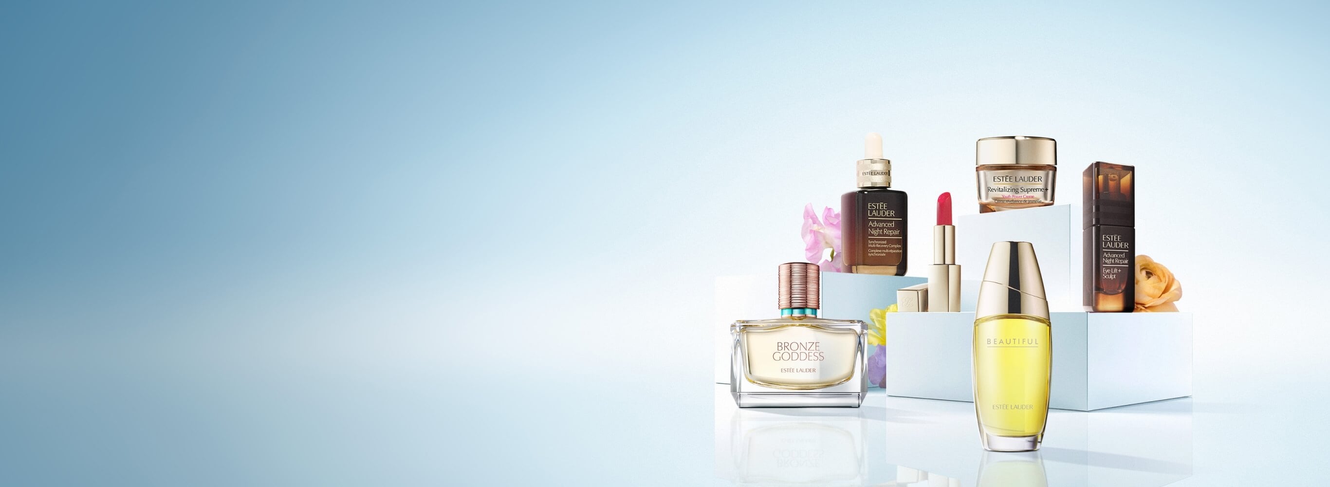 Estée Lauder products on a pale blue background