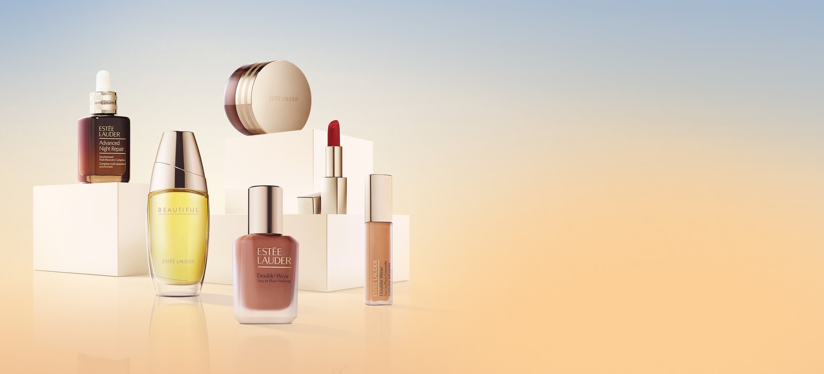 A selection of Estee Lauder products on a blue and orange background