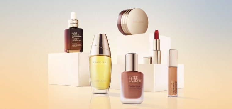 A selection of Estee Lauder products on a blue and orange background