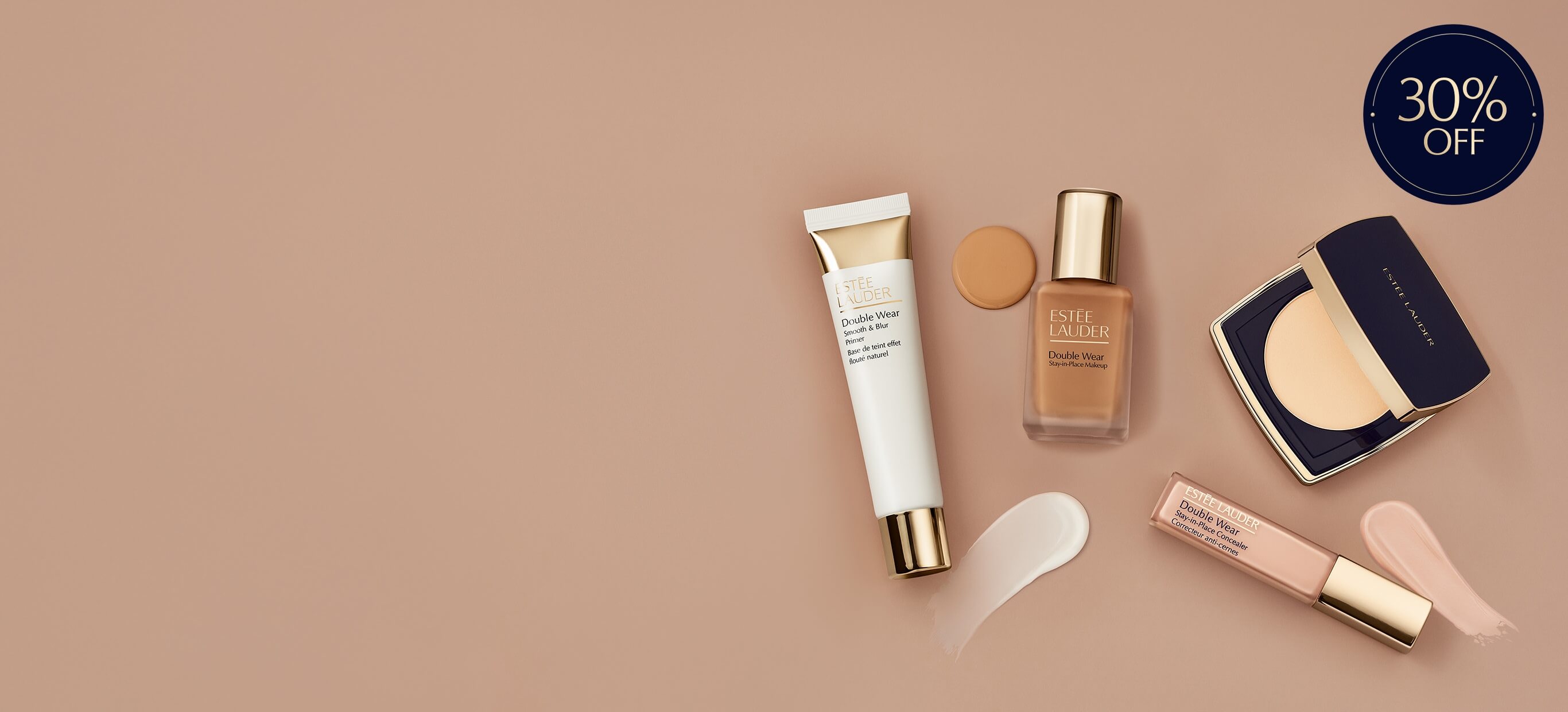 Estee Lauder complexion products on a neutral background