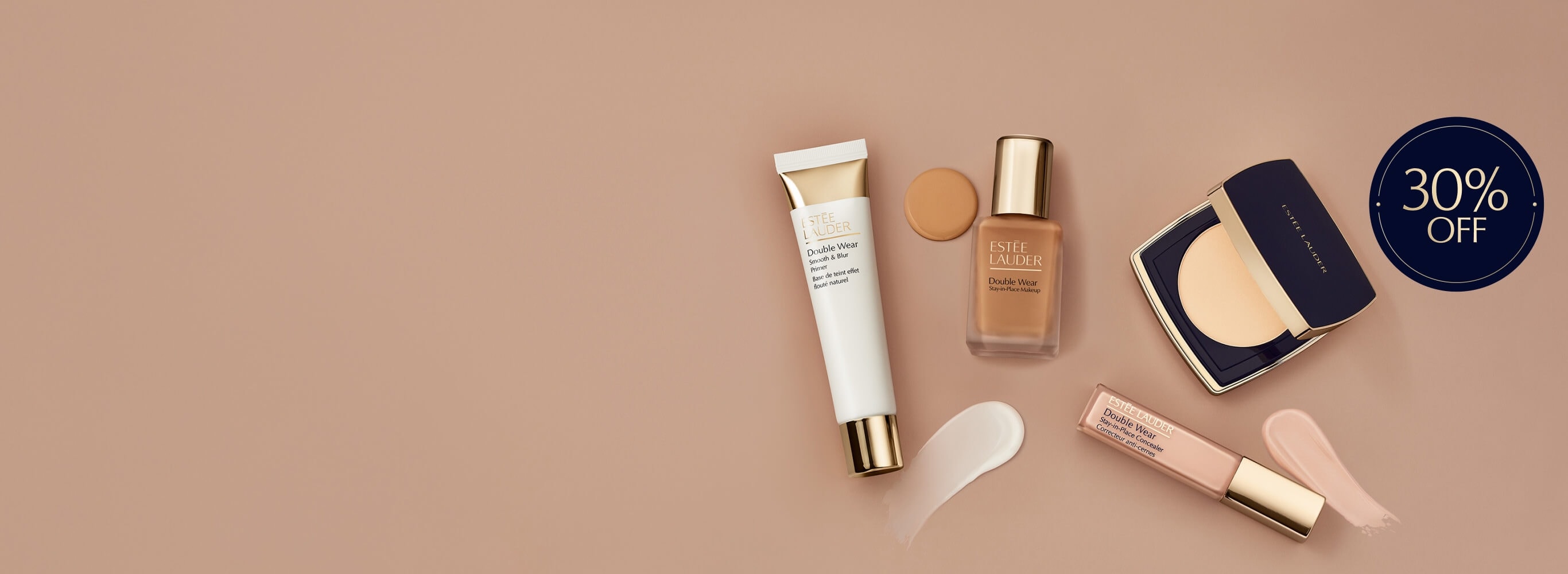 Estee Lauder complexion products on a neutral background