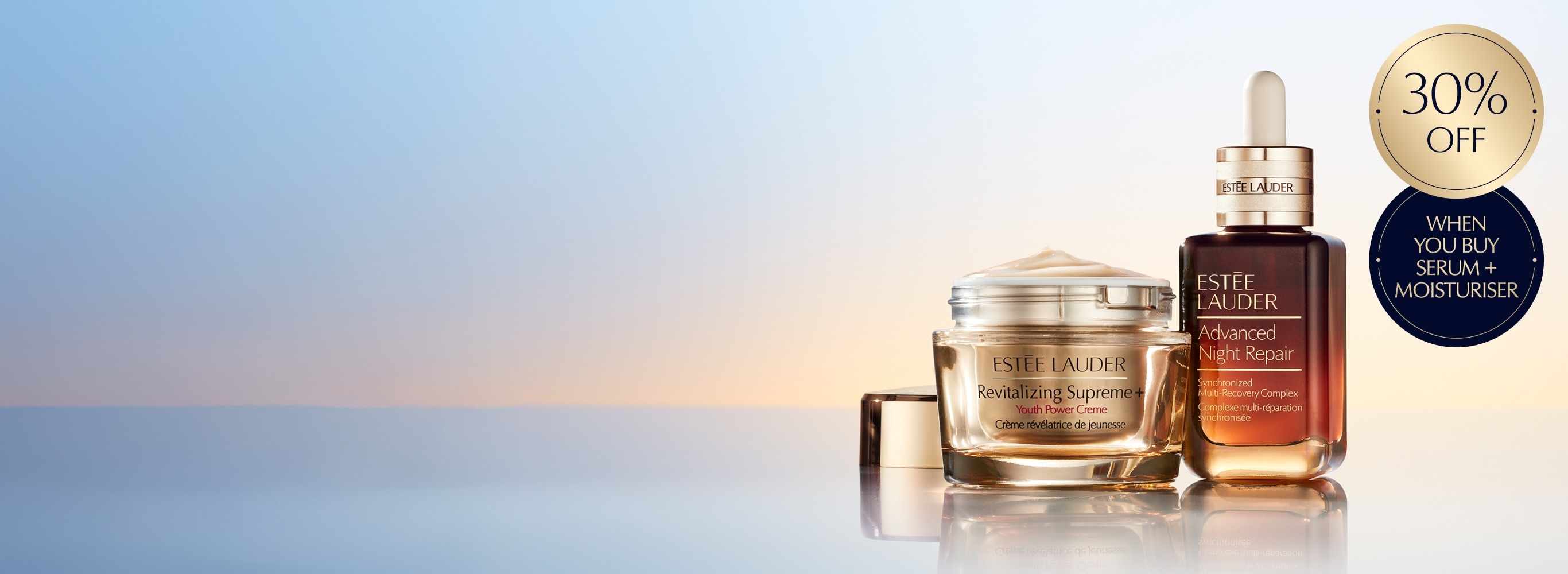 Estée Lauder moisturisers and serums on a light blue and orange background