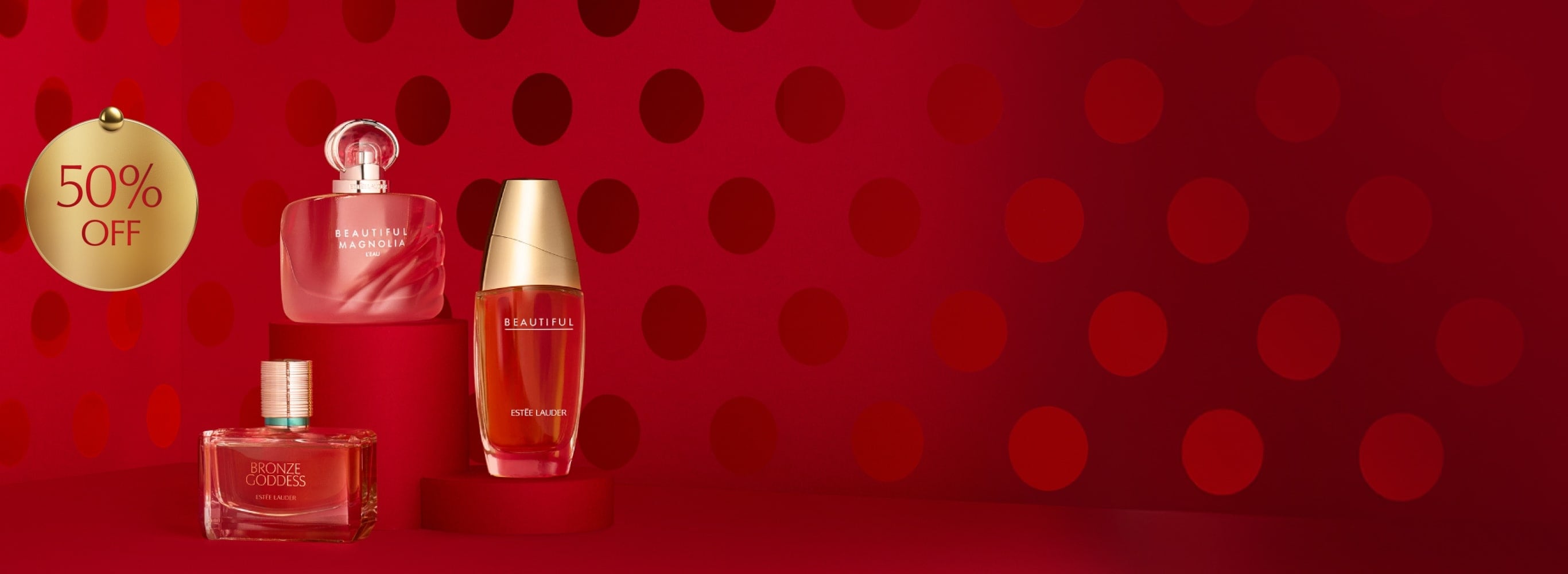 Estée Lauder fragrances on a red background.