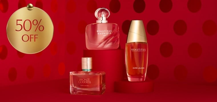 Estée Lauder fragrances on a red background.