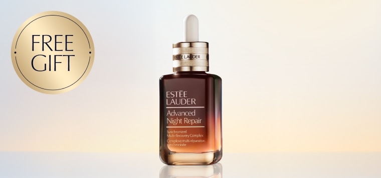 An Estée Lauder Advanced Night Repair on a light blue background