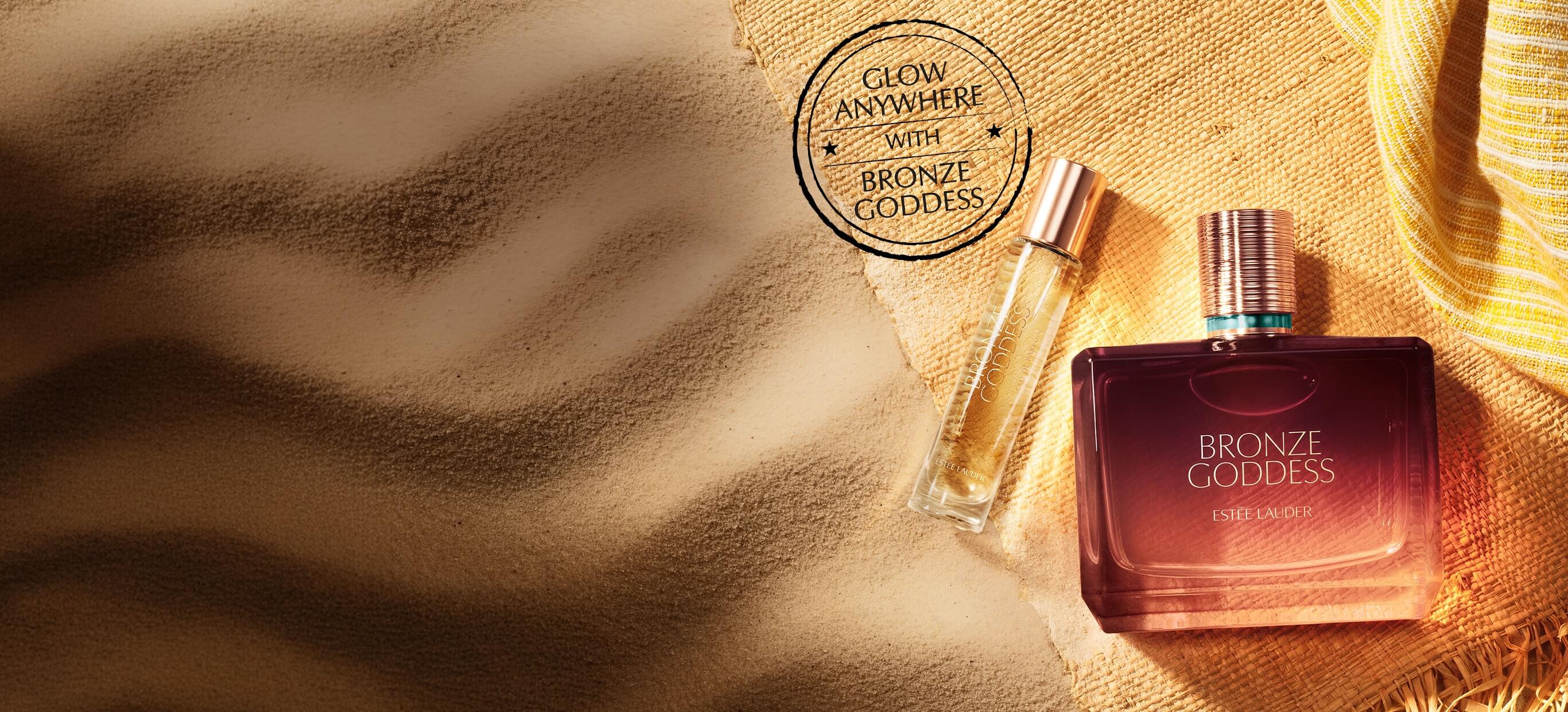 Estee Lauder Bronze Goddess Fragrance on a sandy background