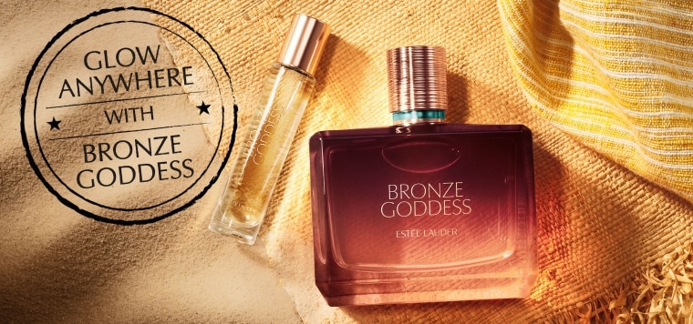 Estee Lauder Bronze Goddess Fragrance on a sandy background