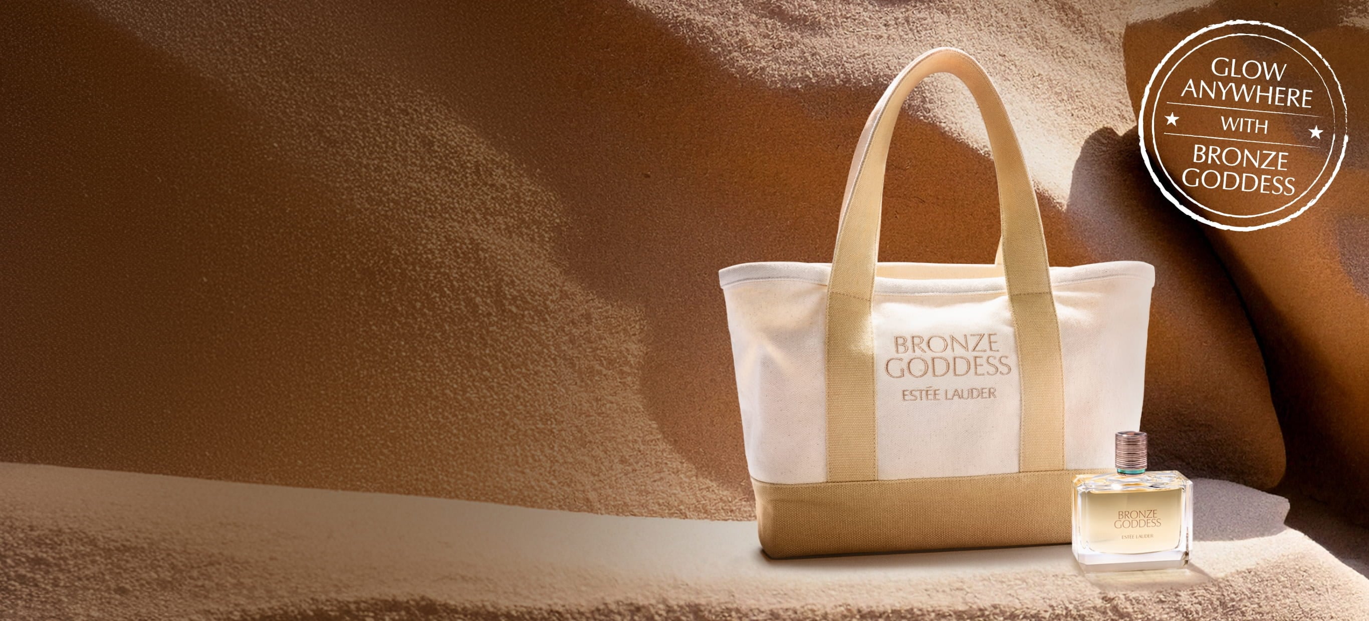 An Estée Lauder tote bag on sand
