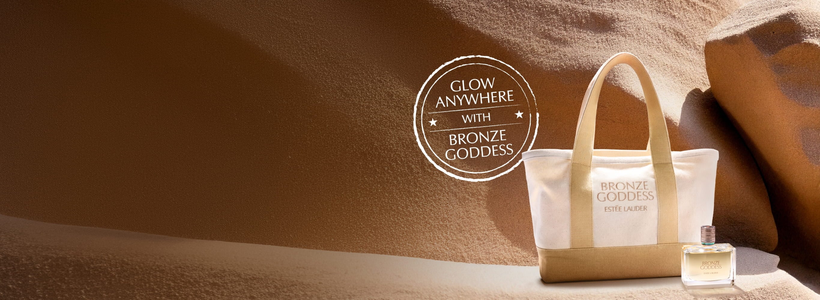 An Estée Lauder tote bag on sand