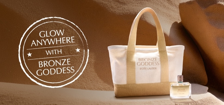 An Estée Lauder tote bag on sand