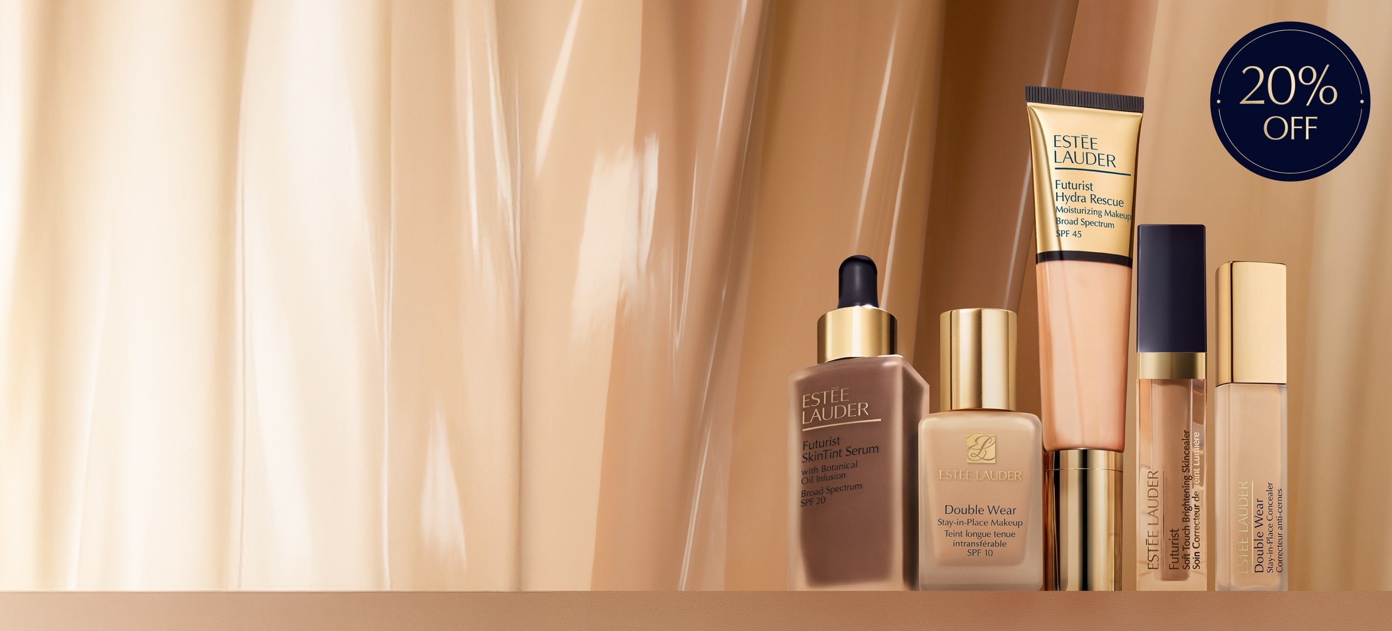Estée Lauder foundations and concealers on a nude curtain background