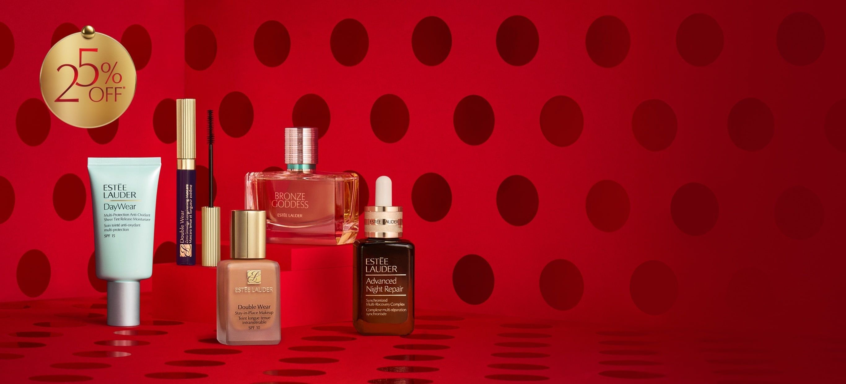 Estée Lauder products on a red background.