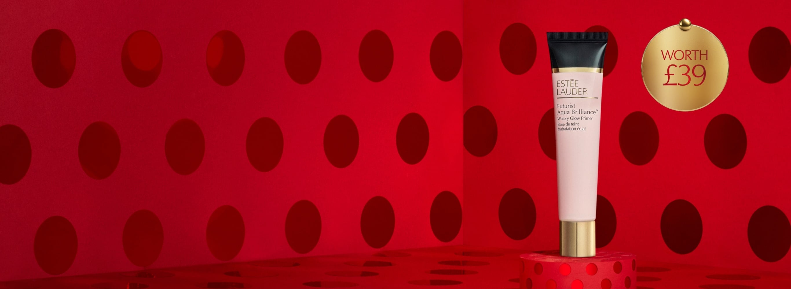 A Futurist Aqua Brilliance Watery Glow Primer on a red background.