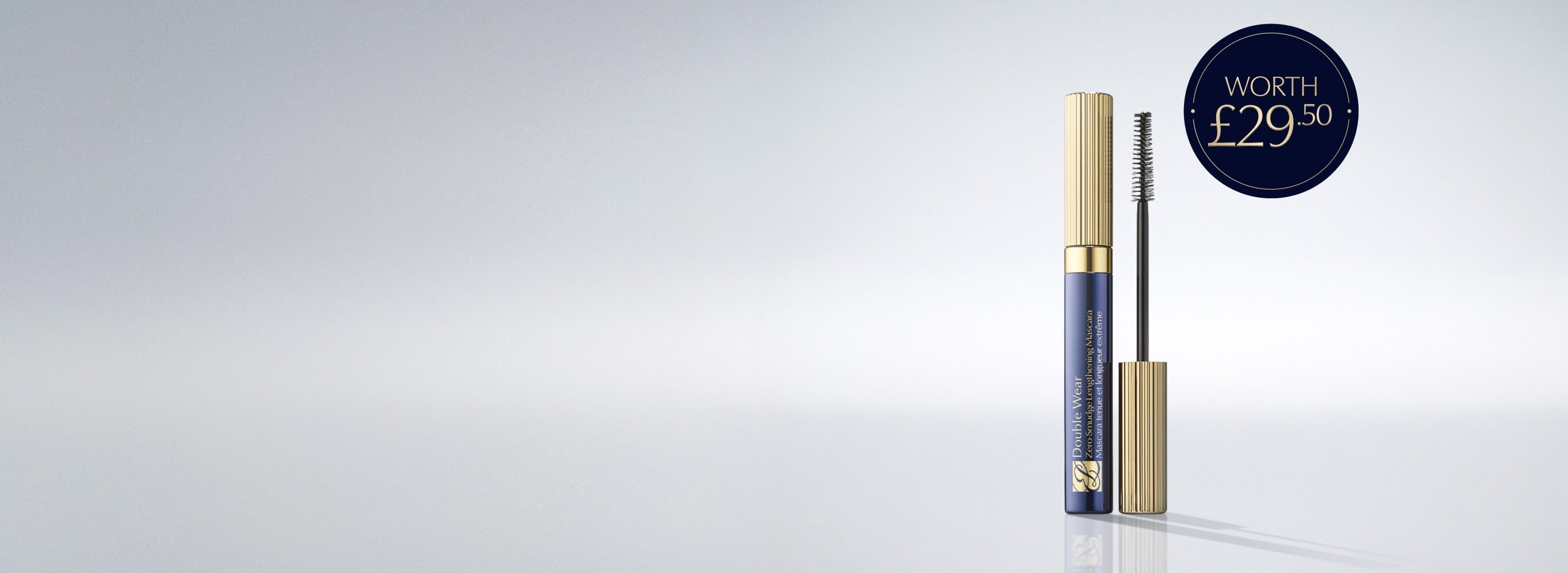 A selection of Estée Lauder products on a white background.