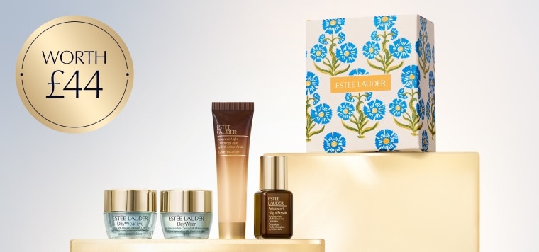 A selection of Estee Lauder products on a blue background
