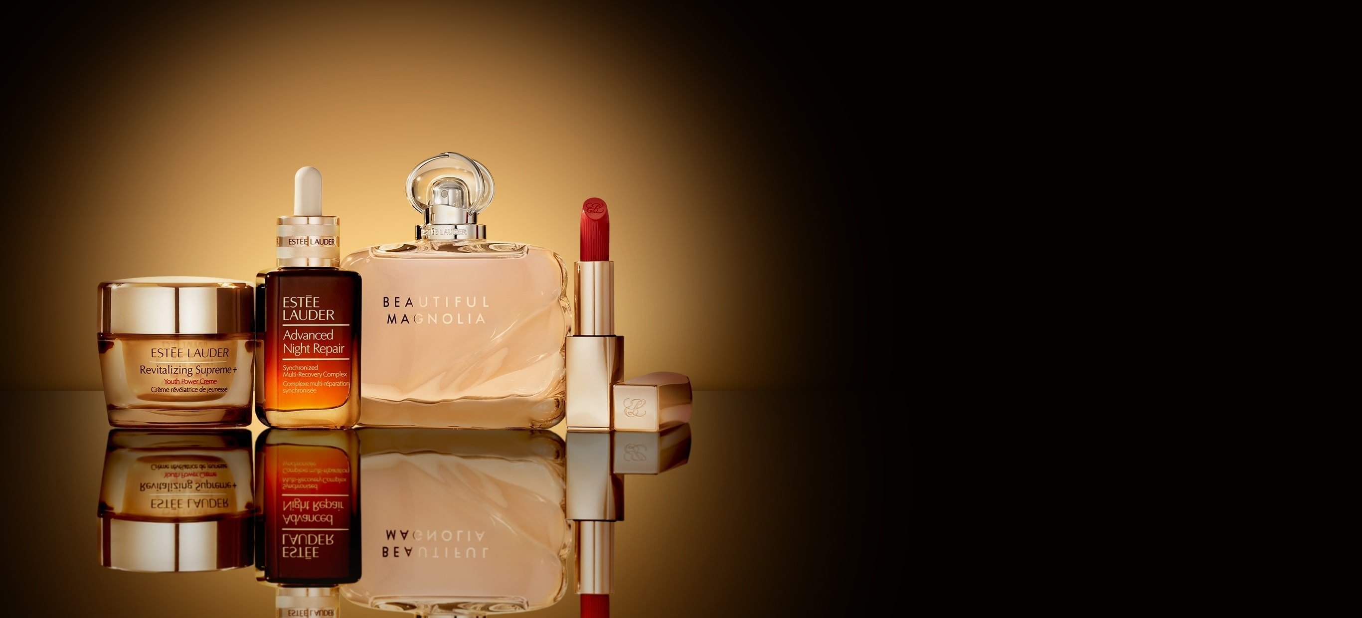 Estée Lauder bestsellers on a dark background with a glow surrounding them.