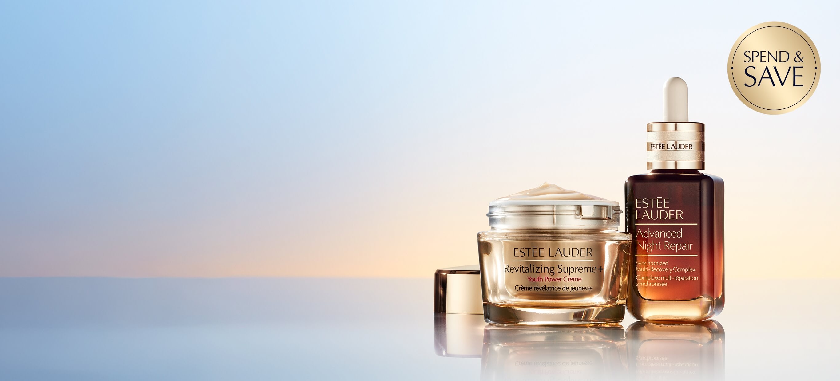 Estée Lauder skincare products on a pale blue background