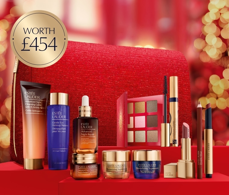 A selection of Estee Lauder products on a red background