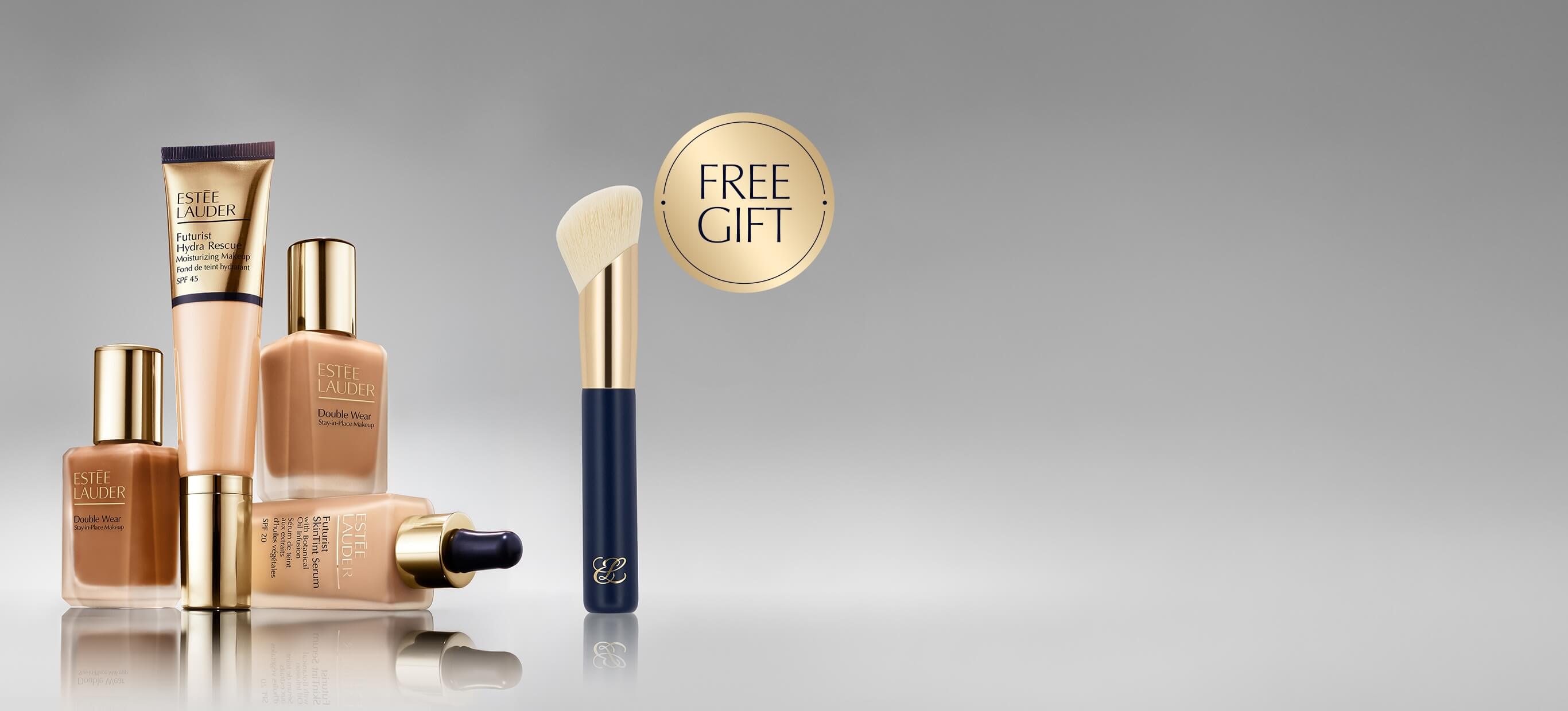 A selection of Estee Lauder foundation products on a grey background