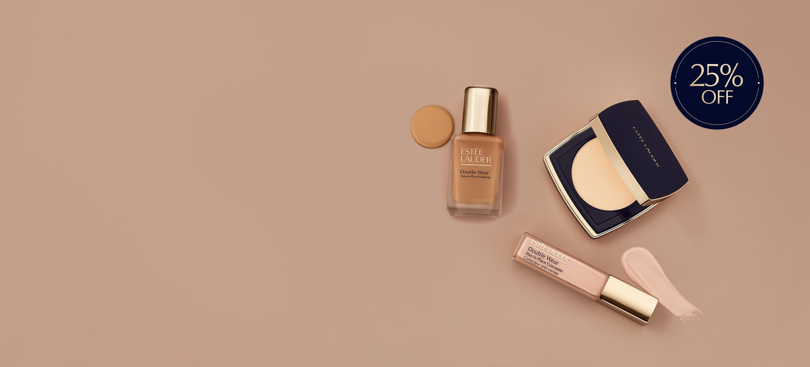 Estee Lauder foundation and concealer products on a neutral background
