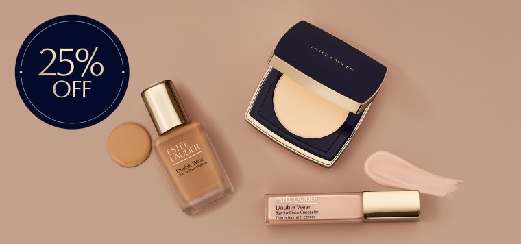 Estee Lauder foundation and concealer products on a neutral background