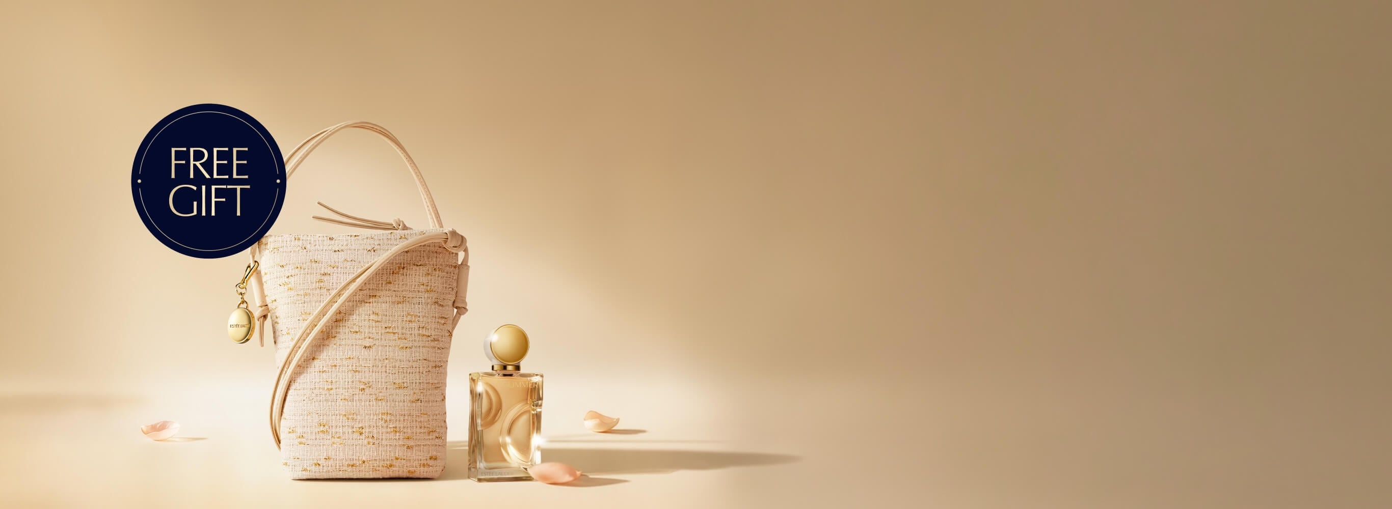 A selection of Estee Lauder products on a light brown background