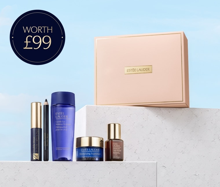 A selection of Estee Lauder products on a blue background