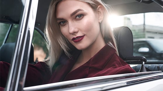 Karlie Kloss sits in the driving seat 