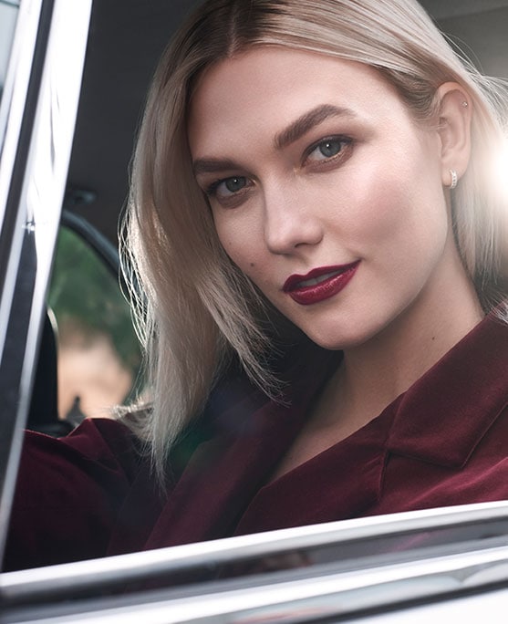 Karlie Kloss sits in the driving seat 