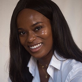 Dr Ewoma smiling to camera