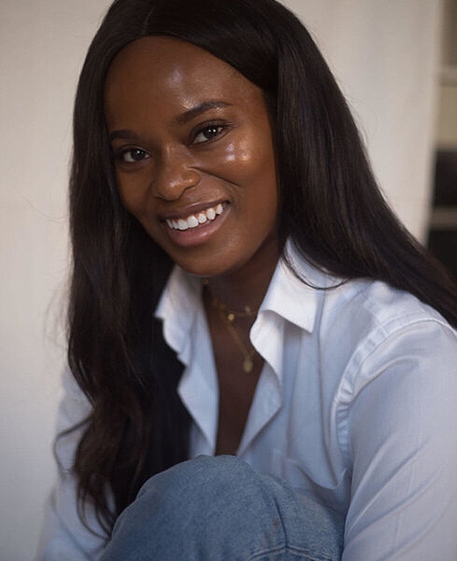 Dr Ewoma smiling to camera
