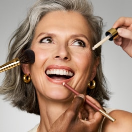 photo of woman applying estee lauder morning skincare routine