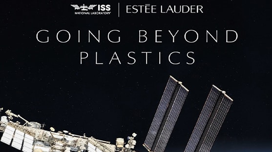 Satellite in space orbiting the earth. 'Going Beyond Plastics' text with Estée Lauder Companies and International Space Station National Laboratory logos. 