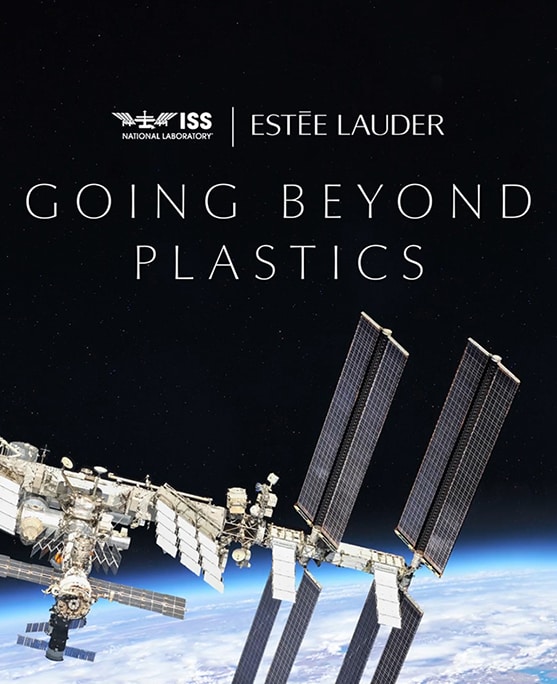 Satellite in space orbiting the earth. 'Going Beyond Plastics' text with Estée Lauder Companies and International Space Station National Laboratory logos. 