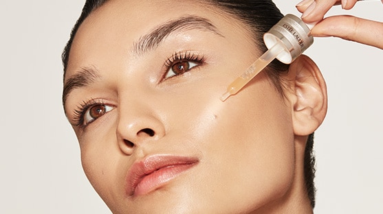 photo of woman applying estee lauder morning skincare routine