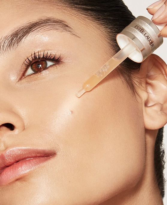 photo of woman applying estee lauder morning skincare routine