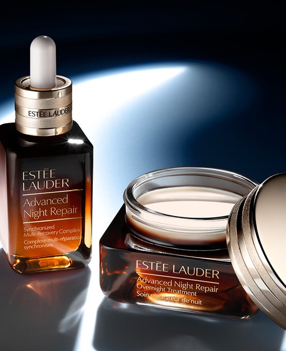 Advanced Nihgt Repair Serum and Advanced Night Repair Overnight Treatment on a dark blue background