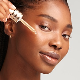 photo of woman applying advanced night repair serum to repair skin barrier