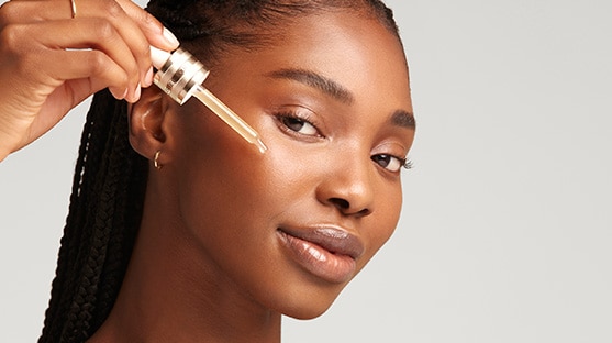 photo of woman applying advanced night repair serum to repair skin barrier