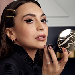 Zara Martin applying makeup