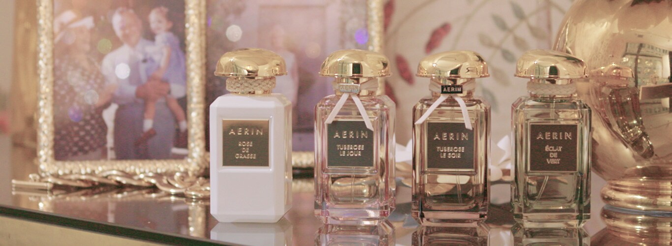 Four Aerin fragrances on a vanity counter. 
