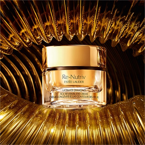 Ultimate Diamond moisturiser and serum on a golden background
